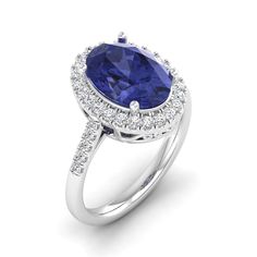 Introducing our exquisite oval blue tanzanite and diamond ring, a true embodiment of elegance and sophistication. Crafted with meticulous attention to detail, this stunning piece showcases a captivating oval-shaped blue tanzanite at its center, radiating a mesmerizing hue that captures the essence of tranquility. Surrounding the tanzanite are dazzling diamonds, meticulously set to enhance its brilliance and create a harmonious contrast. With its timeless design and impeccable craftsmanship, this Elegant Oval Tanzanite Rings, Oval Tanzanite Diamond Ring For Formal Occasions, Formal Tanzanite Diamond Ring, Oval Shape, Formal Tanzanite Diamond Ring Oval Shape, Oval Blue Tanzanite Sapphire Ring, Oval Tanzanite Diamond Ring With Accent Stones, Formal Oval Tanzanite Diamond Ring, Oval Tanzanite Blue Rings, Oval Tanzanite Blue Diamond Ring