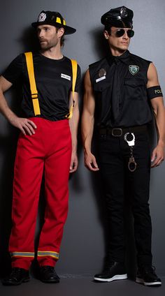 two men dressed in costumes standing next to each other with their hands on their hipss