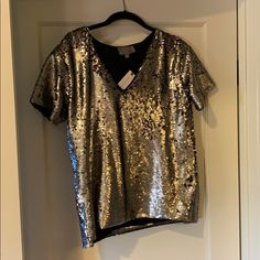 Party Shirt I’ve Never Found A Reason To Wear. Boxy Fit, V-Neck. V-neck Shimmer Tops For Party Season, Silver Crew Neck Top For Party, Glamorous Short Sleeve T-shirt For Night Out, Silver Sequined Short Sleeve Tops, Shimmer V-neck Tops For Party Season, Party Season Shimmer V-neck Tops, Metallic V-neck Top For Party, Metallic V-neck Top For Night Out, Metallic Tops For Festive Summer Occasions