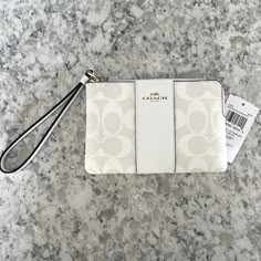 Nwt Coach Signature Cross Grain Leather Corner Zip Wristlet Color- Glacier White Measurements- Approx. 6 X 4 Inches Zipper Closure. 2 Slip Pockets Inside. Smoke Free Home Coach Clutch, Uniqlo Bags, Cute Wallets, Bags Coach, Wristlet Clutch, Monogrammed Leather, Pretty Bags, Signature Canvas, Wristlet Wallet