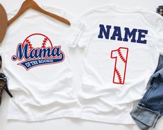 Celebrate your little one's first birthday with our Custom Rookie of the Year Shirt! This Personalized Baseball Shirt is perfect for your rookie's big day, with custom options for name and number. Ideal for family photos, matching sets like Mommy of the Rookie and Daddy of the Rookie complete the look, making it a memorable celebration. Whether it's a gift for a young baseball fan or a fun family tee, this Boys Baseball Shirt adds charm to any event. Get ready to cheer on your little rookie in style! ✨ This t-shirt features a hand-pressed design with a soft touch, providing all-day comfort. ✨ 🔴 HOW TO ORDER 🔴 1️⃣ Review all photos carefully. 2️⃣ Select the size and color from the drop-down menus. 3️⃣ Choose the quantity you want. 4️⃣ Provide personalization details in the box if offered Baseball Concessions, Rookie Of The Year Birthday, Concessions Banner, Dry Cleaning Machine, Baseball First Birthday, Baseball Banner, 1st Birthday Shirt, Baseball Tshirt, Number Shirt