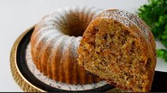 a bundt cake is cut in half on a plate