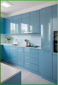 a kitchen with blue cabinets and white counter tops