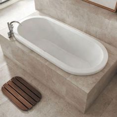 a bath tub sitting on top of a bathroom floor