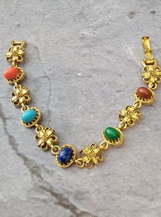 "Lovely vintage ART cabochon bracelet.  Multi colored lucite cabochons on a goldtone bracelet.  Foldover clasp. 7\" length." Cabochon Bracelet, Fort Worth, Chain Link Bracelet, Link Bracelets, Chain Link, Multi Colored, Vintage Art, Fort, Jewelry Bracelets