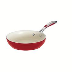 a red and white frying pan on a white background