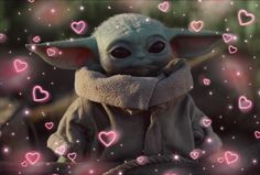 a baby yoda with hearts all over it's face and arms, sitting in front of a backdrop of pink lights