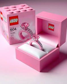 a pink box with a ring in it