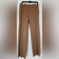 Classic, Elegant And Very On Trend Wide Leg Pants By The Luxury Brand Maxmara Made Of 100% Fine, Pure Camel Hair That Is Extremely Soft And Warm Signature Pick-Stitched Slash Side Pockets And Fly Double Bar Tab, Inside Button And Zipper Closure Serge-Finished Leg Edge Ready To Hem To Your Desired Length Includes Two Extra Buttons Waist 17-1/2” Seam To Seam Leg Opening 10-1/2” Seam To Seam Made In Italy Elegant Beige Wide Leg Pants With Straight Hem, Beige Straight Hem Pants For Office, Luxury Beige Workwear Pants, Elegant Fitted Brown Wide Leg Pants, Beige Straight Leg Pantsuit For Formal Occasions, Beige Straight Leg Formal Pantsuit, Beige Formal Straight Leg Pantsuit, Elegant Brown Full-length Dress Pants, Luxury Brown Workwear Pants