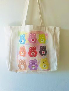 canvas bag adorned with cute rainbow bears!! Cute Multicolor Canvas Tote Bag, Handpainted Tote Bags, Merchandise Ideas, Painted Tote, Crochet Cow, Cute Rainbow, Cute Tote Bags, Care Bears, Custom Bags