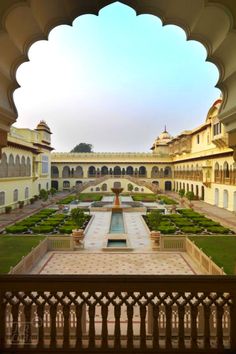 an ornate courtyard with a fountain in the middle