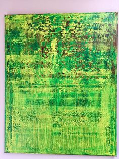 an abstract painting with green and brown colors on the wall in front of a white background