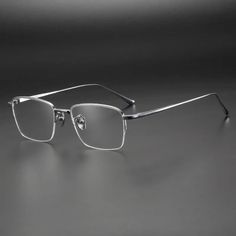 Discover the epitome of sophistication and style with the Muzz Men's Semi Rim Square Titanium Eyeglasses 10134. Crafted by the esteemed brand MUZZ, these eyeglasses are designed to elevate your look with a touch of elegance. Embrace the durable and lightweight titanium frame that sets these eyeglasses apart, ensuring both comfort and resilience for long-term use. The semi-rim square shape exudes a modern and sleek aesthetic that complements various face shapes with effortless charm. Elevate your Silver Rimless Sunglasses For Formal Occasions, Formal Rimless Sunglasses With Metal Frame, Classic Formal Sunglasses With Metal Frame, Formal Silver Anti-reflective Sunglasses, Modern Metal Frame Sunglasses For Formal Occasions, Eyeglass Accessories, Eyewear Trends, Clip On Sunglasses, Fashion Eyeglasses