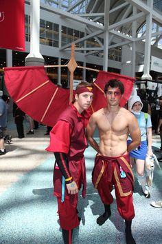 two men in costumes standing next to each other