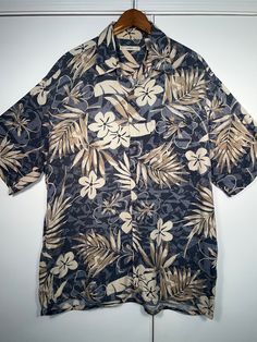 Island Style Hawaiian Style Button Down. Shirt is very nice material and amazing looking.  Classic style Hawaiian shirt perfect for the Lua! Island Style. Nice shirt!  100% Rayon Size Large (L) No odors, no damage, great condition, clean.  Please message me with any questions or for size measurements needed. All orders are packed and shipped with care. Short Sleeve Hawaiian Camp Shirt With Buttons, Hawaiian Camp Shirt With Short Sleeves, Hawaiian Camp Shirt With Short Sleeves And Buttons, Hawaiian Camp Shirt With Buttons And Short Sleeves, Patterned Beach Shirt With Button Closure, Hawaiian Vacation Tops With Buttons, Hawaiian Collared Shirt With Buttons, Patterned Tops With Button Closure For Vacation, Patterned Shirt With Camp Collar And Button Closure