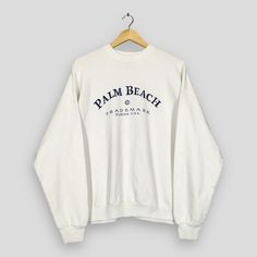 Vintage Palm Beach Florida Usa White Sweatshirt XLarge Palm Beach Florida Usa Spell Out Sweater Palm Beach Jumper Florida Crewneck Size XL Good Used Condition. Have minor stain, REFER PICTURE. Size (On Tag) : Size XL **To make sure if it FITS YOU, refer at the exact measurements. Size Measurement (All measurements were taken lying flat) : Width [armpit to armpit] : 25 inches / 64 cm Length [shoulder to end of garment] : 26 inches / 66 cm THIS IS USED CLOTHING! PLEASE DON`T EXPECTED IT TO BE LIKE White Long Sleeve Tops For Vacation, Relaxed Fit Long Sleeve Sweater For Beach, Casual Long Sleeve Tops For Vacation, Casual Relaxed Fit Sweater For Vacation, Oversized Casual Sweater For Vacation, Long Sleeve Letter Print Beach Top, Oversized Sweatshirt For Beach Vacation, Oversized Sweatshirt For Beach Season Vacation, Relaxed Fit Cotton Beach Sweatshirt