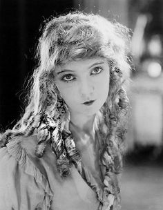 black and white photograph of a woman with curly hair