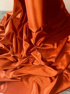 an orange cloth is laying on the floor