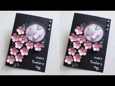 two clocks made out of paper with pink flowers on them