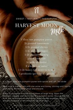 hands holding a cup of coffee with the words harvest moon milk