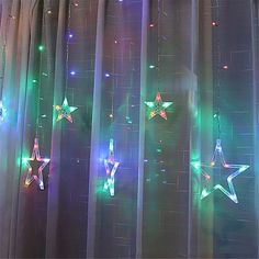 the curtains are decorated with lights and stars