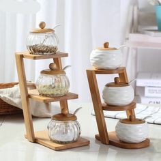 three tiered teapots are sitting on a table