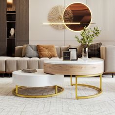 a modern living room with white and gold furniture