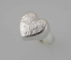 The Heart has long been recognized across cultures as being a powerful symbol for love, charity, joy and compassion. This Beautiful Clean modern open Heart Ring , its made with high quality Sterling Silver 925 Its perfect for anyone any age for any occasions, a great gift for that special someone or yourself. Item Specifications: Item: PAS64 Metal Type: Sterling Silver Metal Stamp:925 Style: Hammered Heart shape Heart Size: 5/8 x 5/8 inch ( approx 16 x 16mm) All jewelry comes in a gift box We wi Symbolic Sterling Silver Heart Ring, Symbolic Heart-shaped Rings For Valentine's Day, Symbolic Heart Shaped Rings As Gifts, Symbolic Heart-shaped Rings For Anniversary, Symbolic Heart-shaped Anniversary Rings, Symbolic Heart-shaped Wedding Ring, Symbolic Heart Shaped Wedding Rings, Symbolic Heart-shaped Promise Ring, Symbolic Heart Ring For Valentine's Day Gift