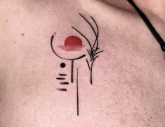 a man's chest with an abstract tattoo design on his left side ribcage