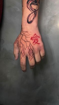 a man's hand with tattoos on it and lightning coming out of the palm