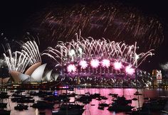 fireworks light up the sky over sydney harbour during new year's eve celebrations in australia