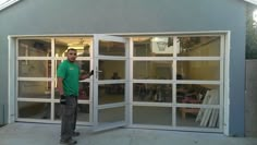 a man standing in front of an open garage door