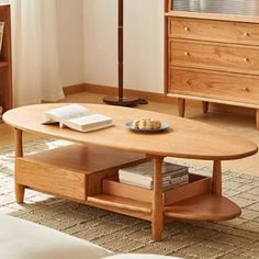 a living room with a coffee table, book shelf and bookshelf in it