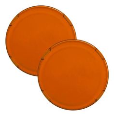 two orange plates sitting next to each other