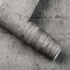 a close up of a knife on the ground with rings around it's edges