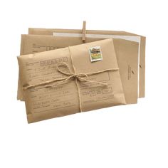 two brown envelopes tied with twine and some postage stamps on top of each other