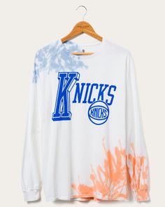 NY Knicks Tie Dye Long Sleeve Tee | Junk Food Clothing – Junk Food Clothing Throwback Long Sleeve T-shirt For Sports Events, Sporty Tie-dye Cotton T-shirt, Sporty Tie-dye T-shirt With Crew Neck, Sporty Tie Dye T-shirt With Crew Neck, Tie Dye Letter Print Tops For Streetwear, Throwback Long Sleeve Tops With Letter Print, Throwback Long Sleeve Top With Screen Print, Throwback Long Sleeve Top With Graphic Print, Streetwear Cotton Tops With Paint Splatter