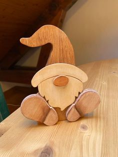 a wooden toy sitting on top of a wooden table