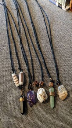 Listing is for one black cord necklace with a slip fastener, wooden beads, and one gemstone wrapped in copper wire. Choices are: Obsidian (black) Howlite (white) Adventurine (green) Amethyst (purple) Moonstone (translucent) Unique Hand Wrapped Necklace With Waxed Cord, Adjustable Copper Wire Crystal Necklaces For Healing, Bohemian Black Necklaces With Copper Wire, Handmade Adjustable Crystal Necklaces With Copper Wire, Handmade Adjustable Crystal Necklace With Copper Wire, Handmade Adjustable Copper Wire Crystal Necklace, Handmade Adjustable Copper Wire Crystal Necklaces, Black Cord Necklace, Necklace Bead