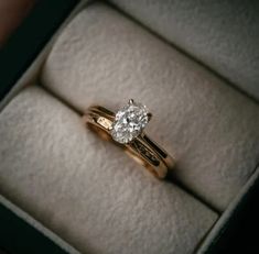 a diamond engagement ring in a box