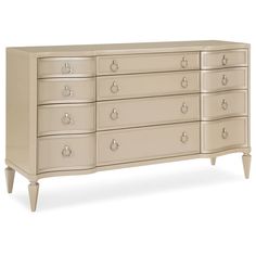 a large white dresser with many drawers