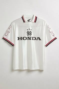 Honda 1998 soccer jersey. Classic jersey in a relaxed fit features graphics at the front and sleeves, complete with contrast striping at the collar and short sleeves. Features Honda 1998 soccer jersey Front and sleeve graphics Regular fit Standard collar and short sleeves with contrast striping Content + Care 100% Cotton Machine wash Imported Size + Fit Model in White s 6’3" and wearing size Large Measurements taken from size Large Chest: 22" Length: 31" | Honda 1998 Soccer Jersey Polo Tee in Wh Us Soccer Jersey, Italian Soccer Jersey, Soccer Jersey Streetwear, Vintage Jerseys Soccer, Soccer Jersey Fit, Stable Ronaldo, Soccer Jersey Outfit Men, Tennis Jersey, White Soccer Jersey