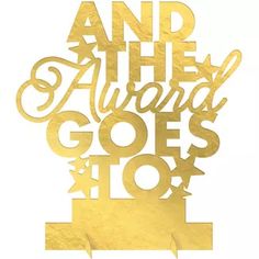 gold foil lettering that says and the award goes to