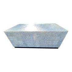 a large concrete block sitting on top of a white floor