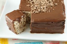 a chocolate cake cut in half on a white plate