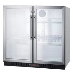 an empty refrigerator sitting on top of a shiny surface with its doors open and the door ajar