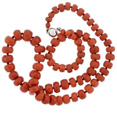 For Sale on 1stDibs - This vintage coral bead necklace is simply stunning! The simple design features a row of graduating coral beads, which are hand strung on red thread, and Luxury Coral Beaded Necklace With Round Beads, Formal Coral Single Strand Beaded Necklace, Formal Single Strand Red Coral Necklace, Adjustable Hand-strung Red Coral Necklace, Red Coral Round Beads Single Strand, Single Strand Red Coral Round Beads, Single Strand Red Coral Beads, Single Strand Round Red Coral Beads, Red Coral Necklaces With Round Faceted Beads