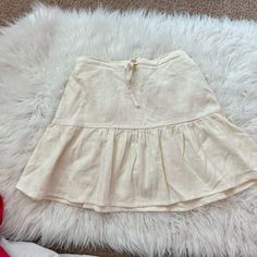 Nwot Super Cute Cream Draw String Mini Skirt Casual Mini Hem Gathered Skirt, Cream Cotton Ruffled Skirt, Beige Tiered Cotton Mini Skirt, Beige Cotton Tiered Mini Skirt, Cotton Cream Mini Skirt With Lining, Cream Cotton Mini Skirt With Lining, Beige Cotton Flared Mini Skirt, Cotton Skirt With Ruffle Hem For Day Out, Cotton Mini Skirt With Ruffle Hem