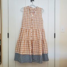 This Plaid Tiered Midi Dress Is So Cute With The Tan Gingham Up Top And The Contrasting Blue Gingham Attached To The Bottom. It Hits Right About The Knees (Depending On Height.... It Hits At The Knees On Someone That's 5'8"). Dress Up With High Heels Or Dress Down With A Denim Jacket And Sandals. Nwt Legnth (Shoulder To Hem): Approx 40" Armpit To Armpit (Laying Flat): Approx 20" Gingham Sleeveless Midi Dress For Day Out, Sleeveless Gingham Midi Dress For Day Out, Sleeveless Gingham Midi Dress For Daywear, Plaid Sleeveless Midi Dress For Daywear, Dresses Casual Boho, Eyelet Lace Dress, Orange Midi Dress, Printed Tunic Dress, Purple Midi Dress