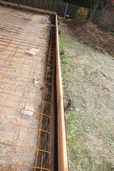 the foundation of a house being constructed with concrete and steel grating on top of it